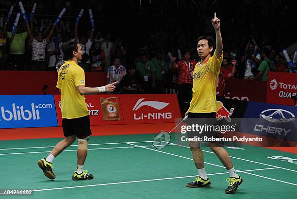 Mohammad Ahsan and Hendra Setiawan of Indonesia react after defating Liu Xiaolong and Qiu Zihan of China in the men doubles final match of the 2015...