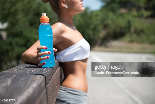 fitness woman with energy drink - sports drink stock pictures, royalty-free photos & images