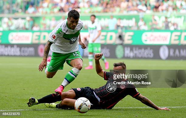 Vierinha of VfL Wolfsburg is challenged by David Abraham of Eintracht Frankfurt during the Bundesliga match between VfL Wolfsburg and Eintracht...