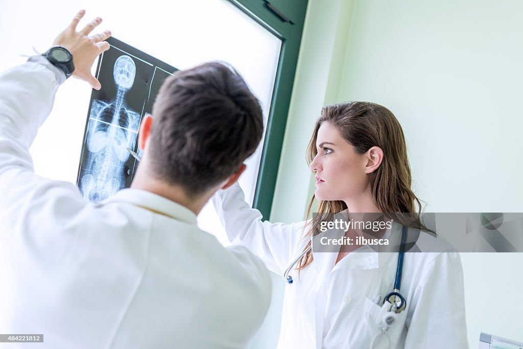 Doctors examining x-ray