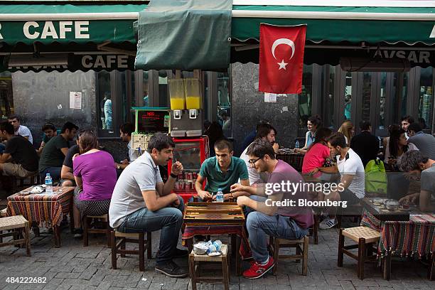 Customers at a teahouse play backgammon in the Besiktas district of Istanbul, Turkey, on Saturday, Aug. 15, 2015. Turkeys central bank lowered the...