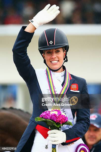 Charlotte Dujardin of Great Britain celebrates winning the Dressage Grand Prix Freestyle individual competition on Day 5 of the FEI European...