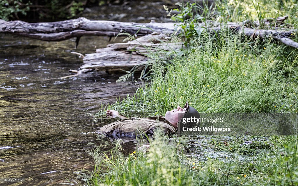 WWII US Army Combat Soldier Casualty Lying in Water