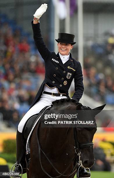 Kristina Broering-Sprehe of Germany on her horse Desperados waves during the Grand Prix Freestyle Dressage Individual Final during the FEI European...