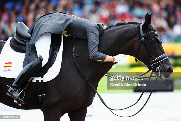 Morgan Barbancon Mestre of Spain reacts on her horse Painted Black during the Dressage Grand Prix Freestyle individual competition on Day 5 of the...