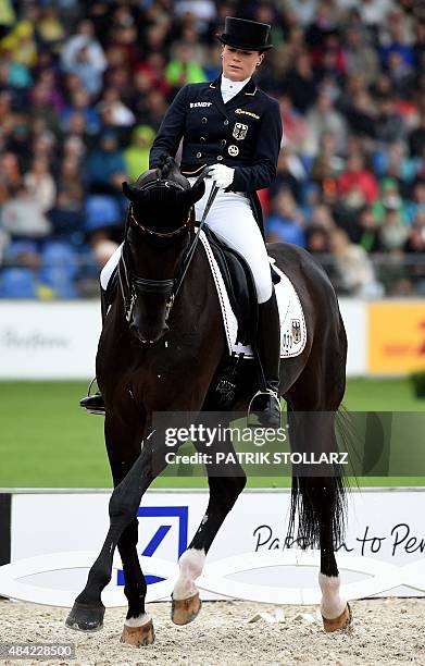 Kristina Broering-Sprehe of Germany on her horse Desperados competes during the Grand Prix Freestyle Dressage Individual Final during the FEI...