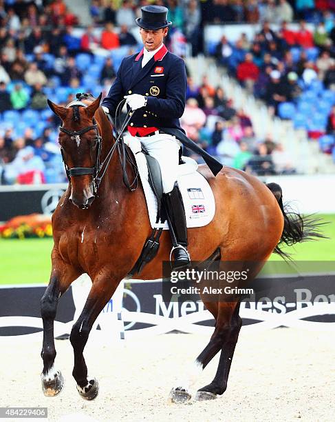 Carl Hester of Great Britain performs on his horse Nip Tuck during the Dressage Grand Prix Freestyle individual competition on Day 5 of the FEI...