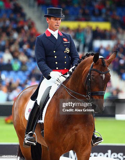 Carl Hester of Great Britain performs on his horse Nip Tuck during the Dressage Grand Prix Freestyle individual competition on Day 5 of the FEI...