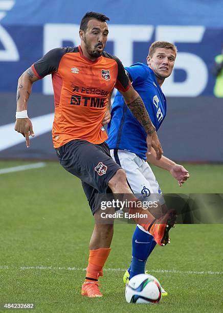 Igor Denisov of FC Dinamo Moscow is challenged by Rohas Asevedo of FC Ural Sverdlovsk Oblast during the Russian Premier League match between Dinamo...