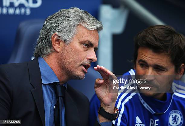 Jose Mourinho, manager of Chelsea talks to Rui Faria, assistant first team coach during the Barclays Premier League match between Manchester City and...