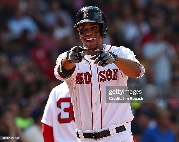 Xander Bogaerts of the Boston Red Sox reacts after his home run in the third inning against the Seattle Mariners at Fenway Park on August 16, 2015 in...