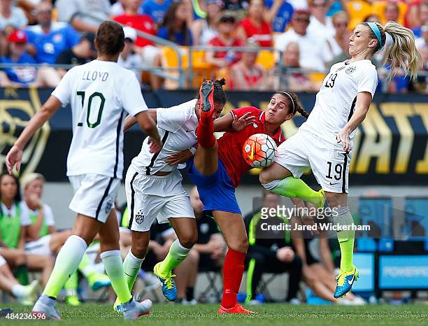Julie Johnston of the United States and Carolina Venegas of Costa Rica step into a loose ball in the first half during the match at Heinz Field on...