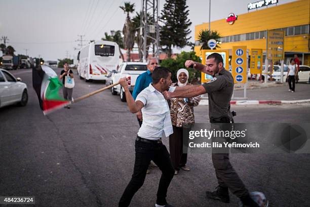 Palestinian activists clash with police as they protest the force feeding of detainee Muhammad Allan at Brazilai hospital on August 16, 2015 in...