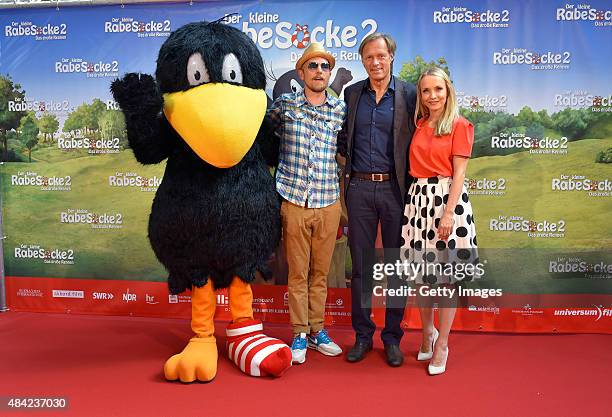 Jan Delay, Gerhard Delling and Janin Ullmann attend the German premiere for the film 'Der kleine Rabe Socke 2 - Das grosse Rennen' at Zeise Kinos on...