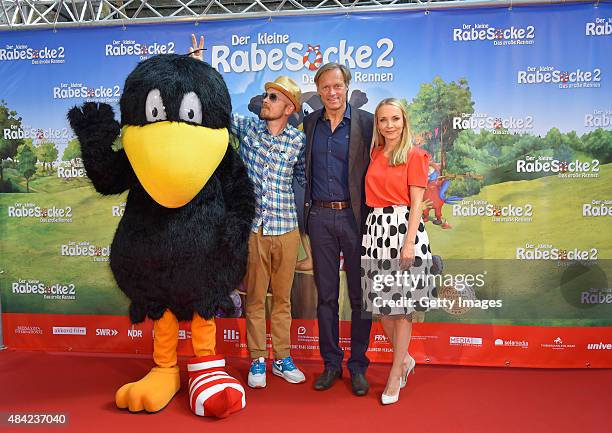 Jan Delay, Gerhard Delling and Janin Ullmann attend the German premiere for the film 'Der kleine Rabe Socke 2 - Das grosse Rennen' at Zeise Kinos on...