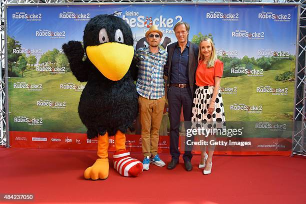 Jan Delay, Gerhard Delling and Janin Ullmann attend the German premiere for the film 'Der kleine Rabe Socke 2 - Das grosse Rennen' at Zeise Kinos on...