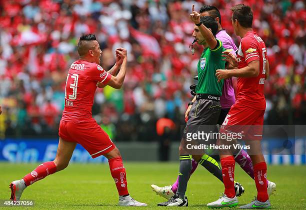Christian Cueva of Toluca reacts against the referee during a 5th round match between Toluca and Chivas as part of the Apertura 2015 Liga MX at...