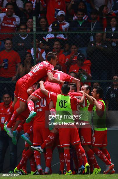 Enrique Triverio of Toluca celebrates with teammates after scoring the second goal of his team during a 5th round match between Toluca and Chivas as...