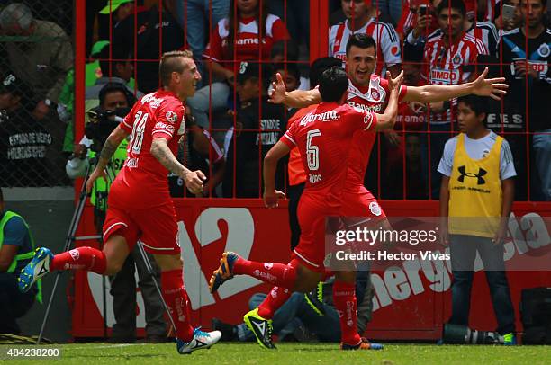 Enrique Triverio of Toluca celebrates with teammates after scoring the second goal of his team during a 5th round match between Toluca and Chivas as...