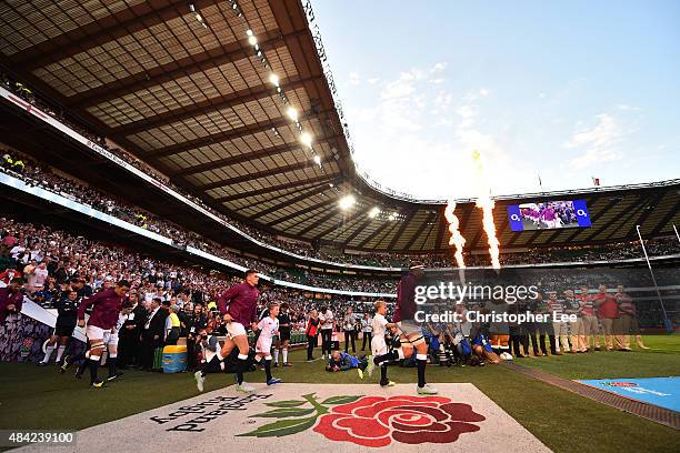 The England team run out onto the pitch during the QBE International match between England and France at Twickenham Stadium on August 15, 2015 in...