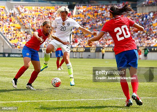 Abby Wambach of the United States reaches for a loose ball in front of Carolina Venegas of Costa Rica in the second half during the match at Heinz...
