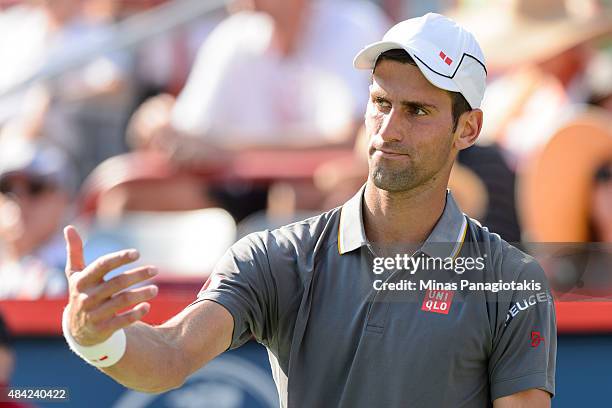Novak Djokovic of Serbia reacts in his match against Andy Murray of Great Britain during day seven of the Rogers Cup at Uniprix Stadium on August 16,...