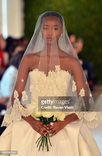 Model walks the runway at the Oscar De La Renta Spring 2015 Bridal collection show on April 11, 2014 in New York City.