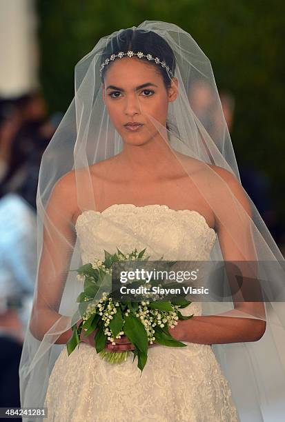 Model walks the runway at the Oscar De La Renta Spring 2015 Bridal collection show on April 11, 2014 in New York City.