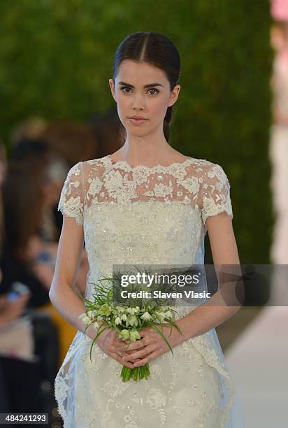 Model walks the runway at the Oscar De La Renta Spring 2015 Bridal collection show on April 11, 2014 in New York City.