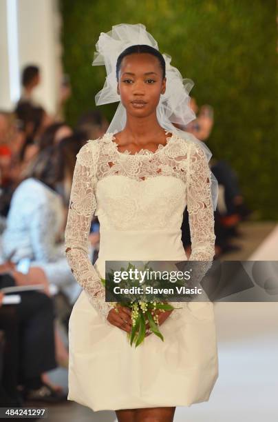 Model walks the runway at the Oscar De La Renta Spring 2015 Bridal collection show on April 11, 2014 in New York City.