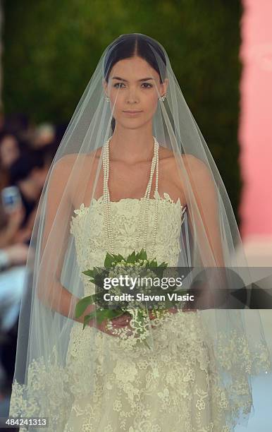 Model walks the runway at the Oscar De La Renta Spring 2015 Bridal collection show on April 11, 2014 in New York City.