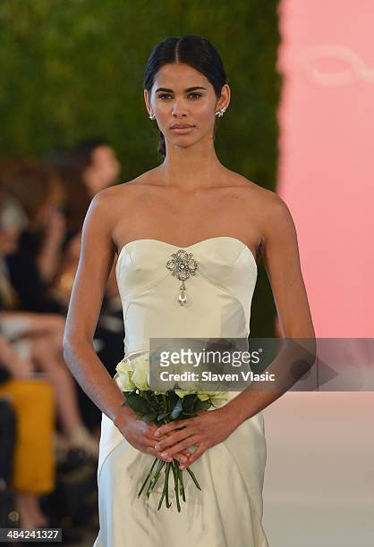 Model walks the runway at the Oscar De La Renta Spring 2015 Bridal collection show on April 11, 2014 in New York City.