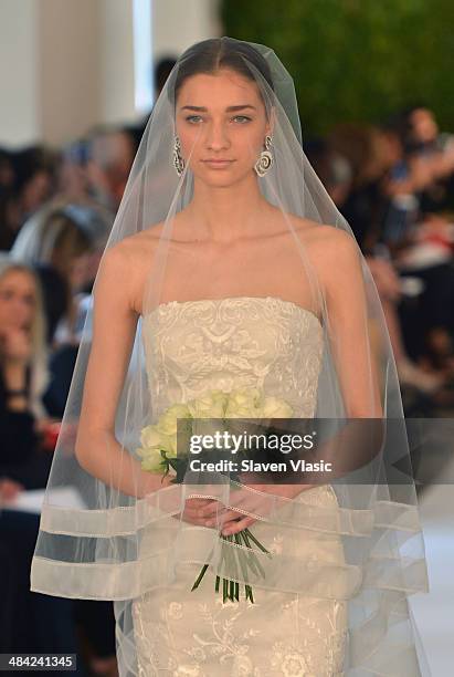 Model walks the runway at the Oscar De La Renta Spring 2015 Bridal collection show on April 11, 2014 in New York City.