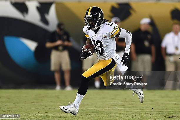 Dri Archer of the Pittsburgh Steelers runs for yards during a preseason game against the Jacksonville Jaguars at EverBank Field on August 14, 2015 in...