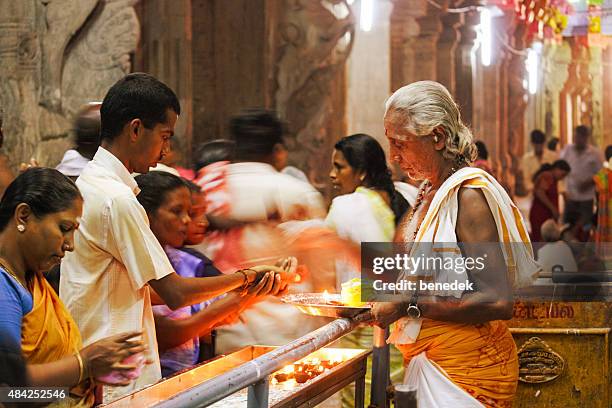 worshipers at meenakshi amman temple in madurai india - hinduism stock pictures, royalty-free photos & images