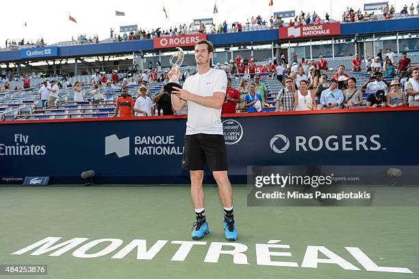 Andy Murray of Great Britain holds up the Rogers Cup after defeating Novak Djokovic of Serbia 6-4, 4-6, 6-3 during day seven of the Rogers Cup at...