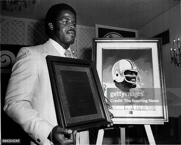 Earl Campbell of the Houston Oilers accepts an award circa 1980s.