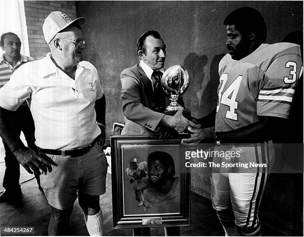 Earl Campbell of the Houston Oilers accepts an award circa 1980s.