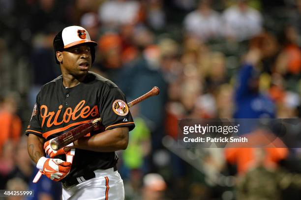 Delmon Young of the Baltimore Orioles reacts after striking out against the Toronto Blue Jays in the seventh inning at Oriole Park at Camden Yards on...