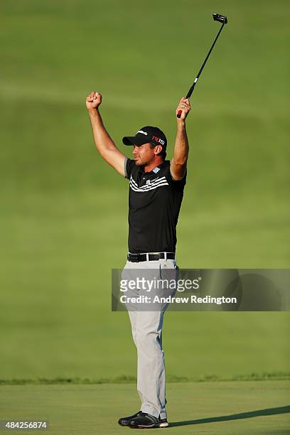 Jason Day of Australia celebrates on the 18th green after winning the 2015 PGA Championship with a score of 20-under par at Whistling Straits on...