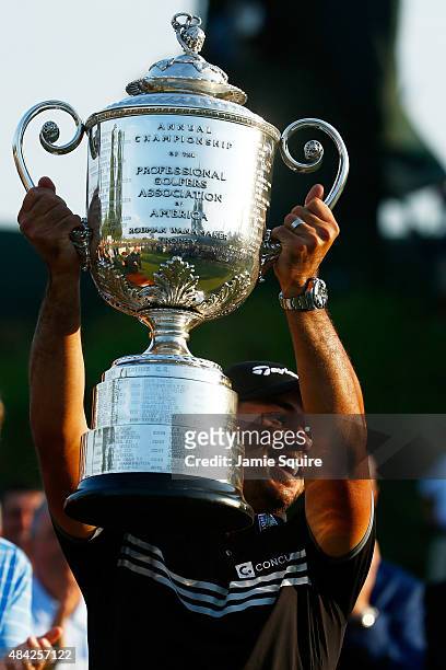 Jason Day of Australia celebrates with the Wanamaker Trophy after winning the 2015 PGA Championship with a score of 20-under par at Whistling Straits...
