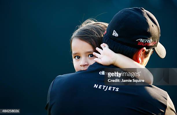 Jason Day of Australia celebrates with his son Dash after winning the 2015 PGA Championship with a score of 20-under par at Whistling Straits on...