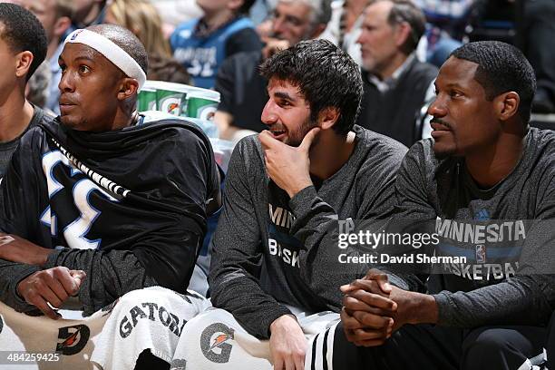 April 11: Ricky Rubio, Othyus Jeffers and Dante Cunningham of the Minnesota Timberwolves look on from the bench during the game against the Houston...