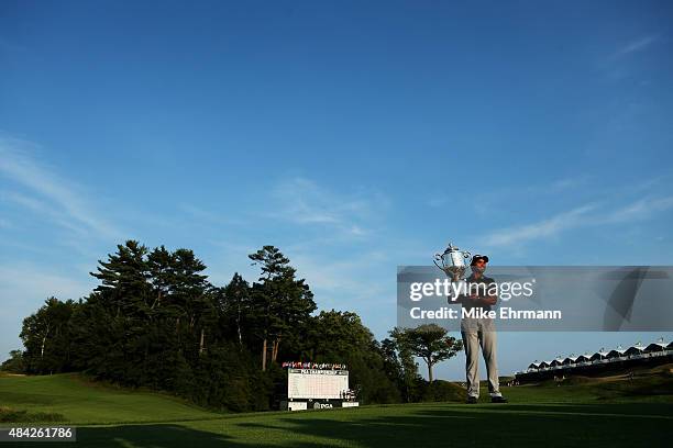 Jason Day of Australia poses with the Wanamaker trophy after winning the 2015 PGA Championship with a score of 20-under par at Whistling Straits on...