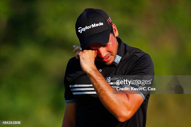 Jason Day of Australia cries on the 18th green after winning the 2015 PGA Championship with a score of 20-under par at Whistling Straits on August...