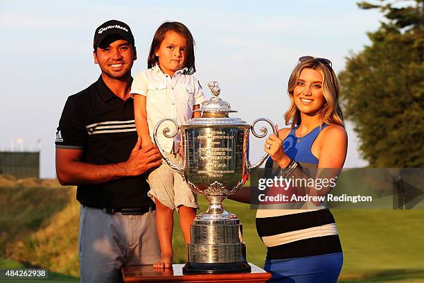 Jason Day of Australia poses with the Wanamaker Trophy and his wife Ellie and son Dash after winning the 2015 PGA Championship with a score of...