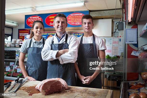 young apprentices at work - butcher stock pictures, royalty-free photos & images