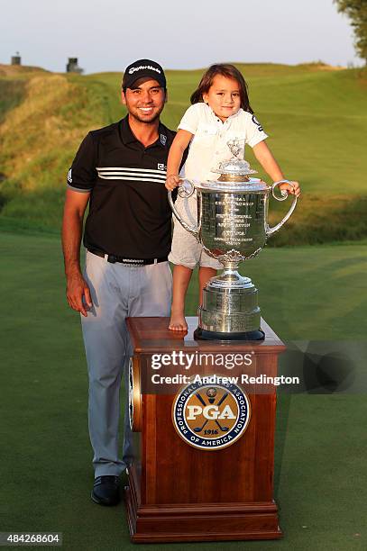 Jason Day of Australia poses with the Wanamaker Trophy and his son Dash after winning the 2015 PGA Championship with a score of 20-under par at...