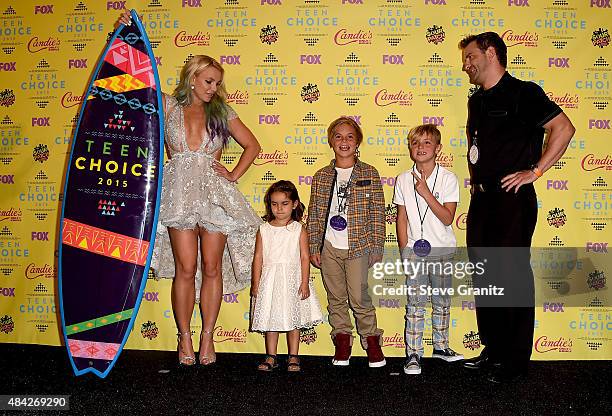 Recording artist Britney Spears poses with Maddie Briann Aldridge, Sean Preston Federline, and Jayden James Federline in the press room during the...