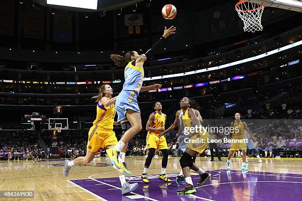 Jacki Gemelos of the Chicago Sky handles the ball against Jennifer Hamson of the Los Angeles Sparks in a WNBA game at Staples Center on August 16,...